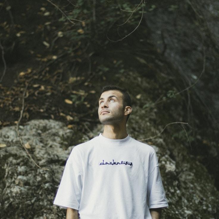 Avery Patel, Lead Design Curator at Grove Atlas Studio, reviewing corporate floral arrangements